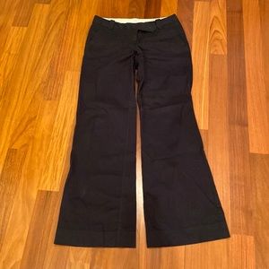 Women’s Black Ann Taylor Loft pants with flare opening at bottom.